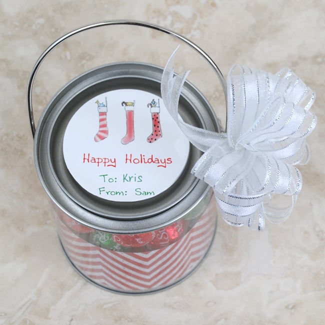 Close up of the circle sticker and mini paint can Christmas favor