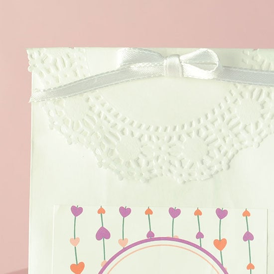 Cute! A simple bow and paper doily make this Valentine's Day favor bag amazing!