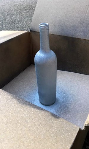 Silver glitter wine bottle for table numbers