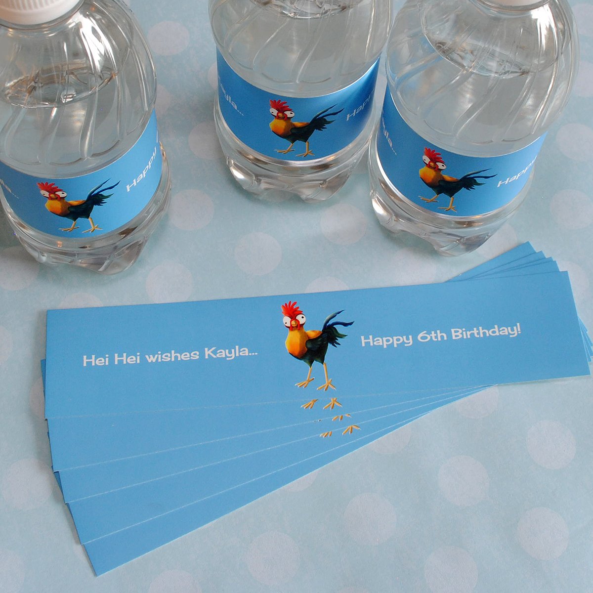 Make your own custom water bottle labels with popular kids party themes. Hei Hei from Moana is the character in this label.