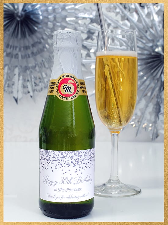 Mini sparkling cider bottle with a custom party favor for a 30th birthday. Make one online now!