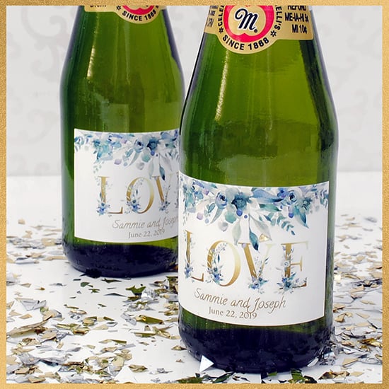Close up of wedding labels for mini sparkling cider bottles. Add your information for party favors that wow!