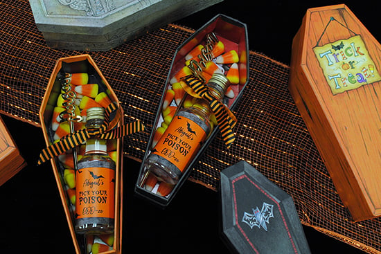 Favor boxes for an adult Halloween party. Mini coffins with personalized mini liquor bottles and a 'poison' swizzle stick.
