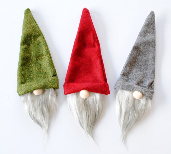 Gnome wine bottle covers come in three colors: green, red, and gray