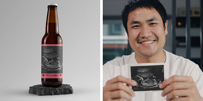 New dad holding photo of ultrasound made into a personalized beer label for a Father's day gift.