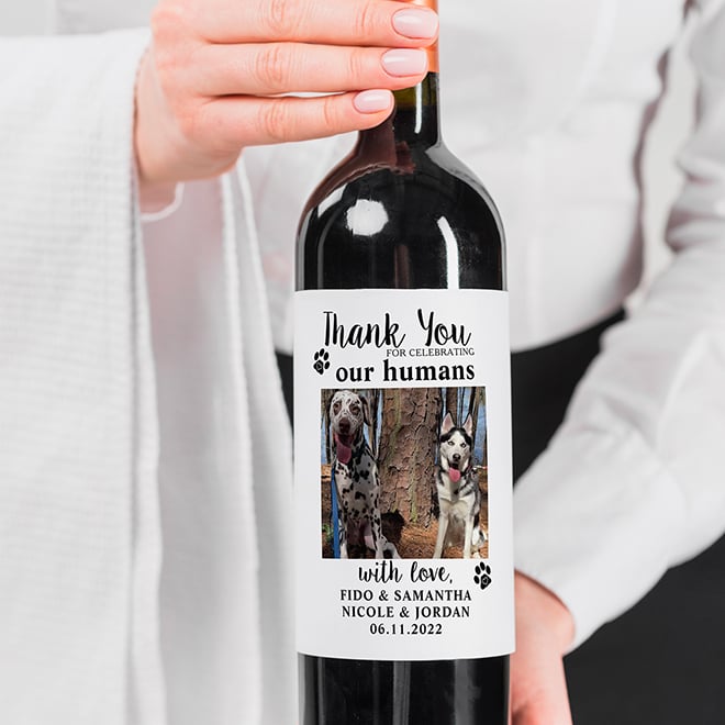 Wedding pet photo on bottle of wine with caption "Thank you for celebrating with our humans." Make your own pet photo wedding wine label or beer label online.