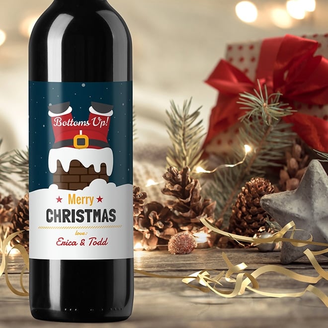 Bottom's Up! Santa has fallen down the chimney on this funny Christmas wine label. Add your holiday greeting for gifts and parties.