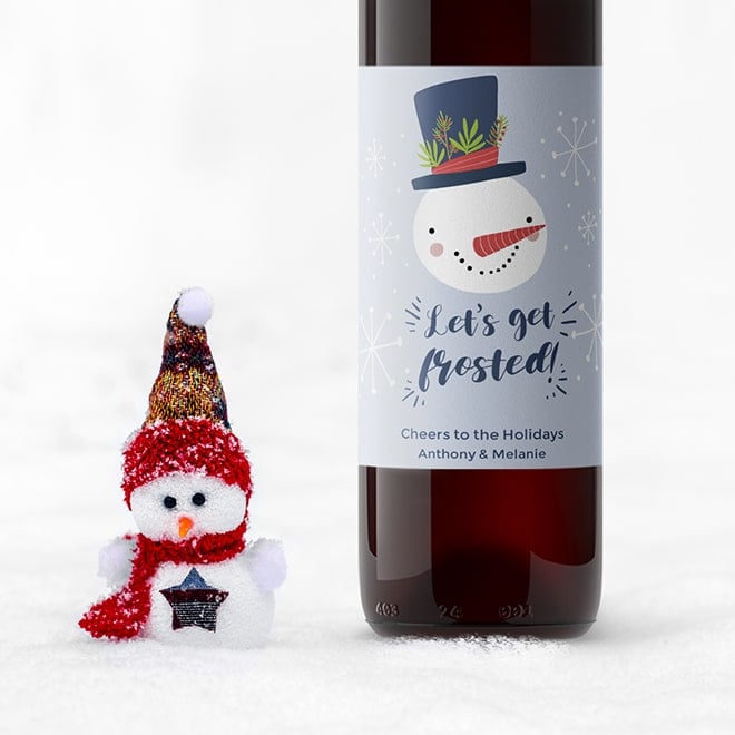 "Let's Get Frosted" Christmas wine label with funny saying. Make a funny Christmas wine label online.